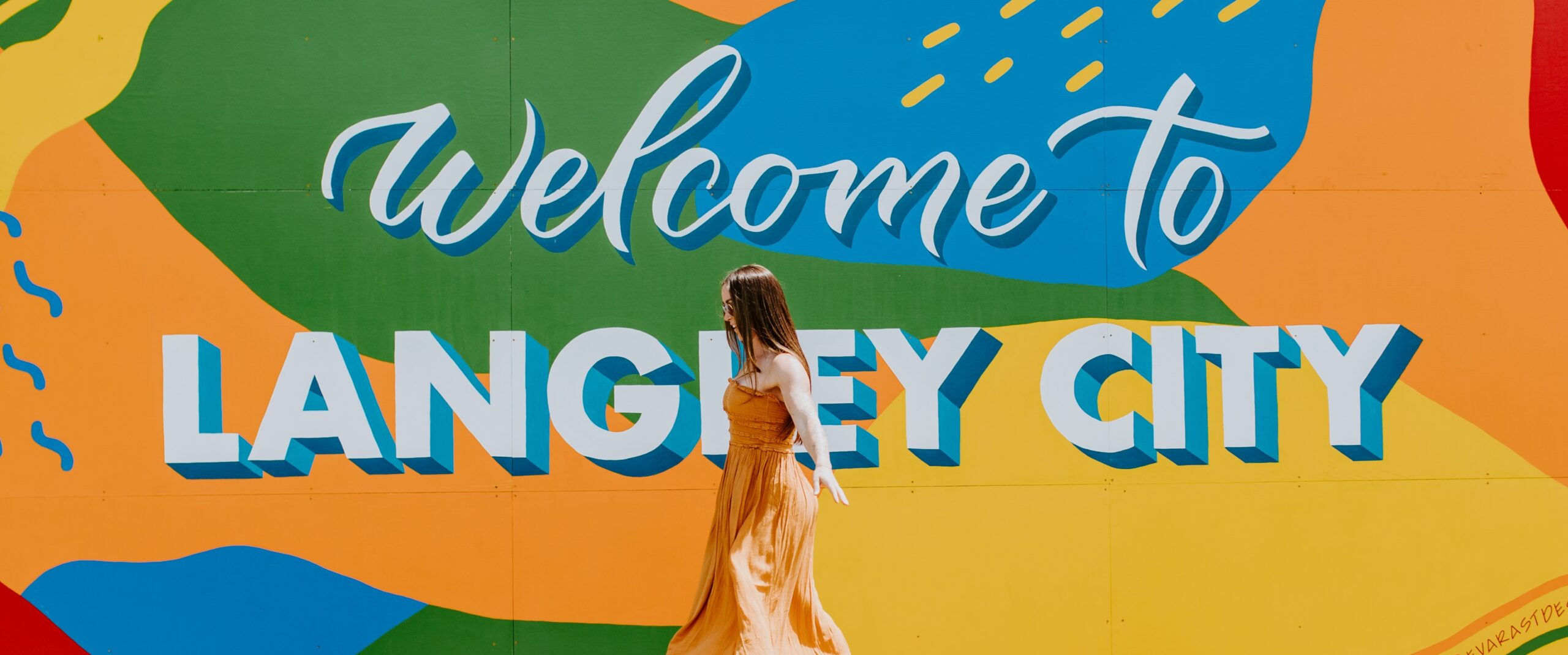 Colourful painted mural with the words Welcome to Langley City.