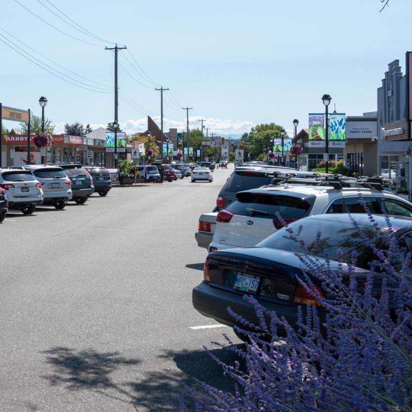 Cars parked along street.